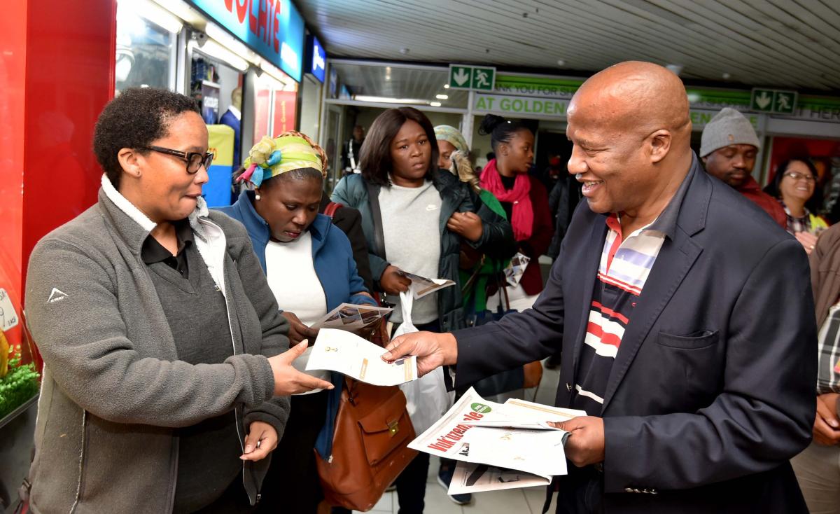 Minister Jackson Mthembu walking about the Cape Town train station precinct to hand out pamphlets to commuters in the morning ahead of the State of the Nation, 20 June 2019